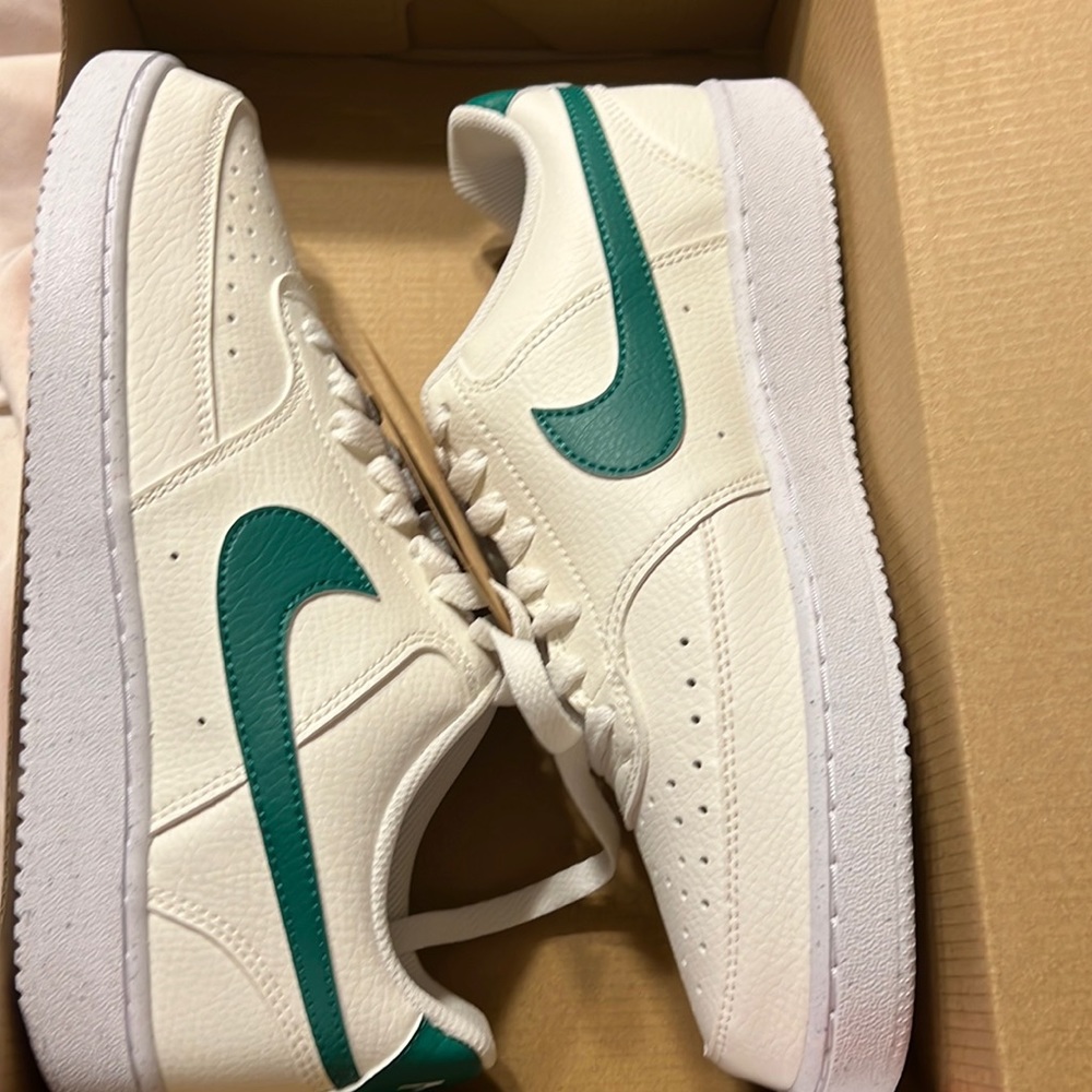 Green and white nike